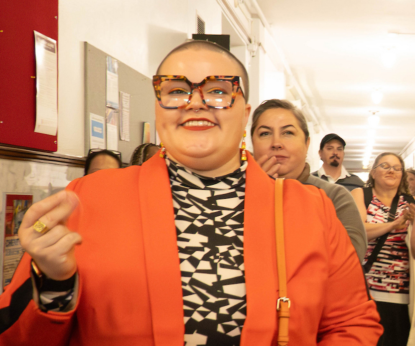 Person smiling at the event.