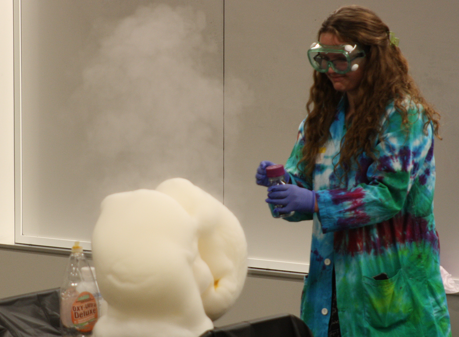 Student scientist with foaming experiment.