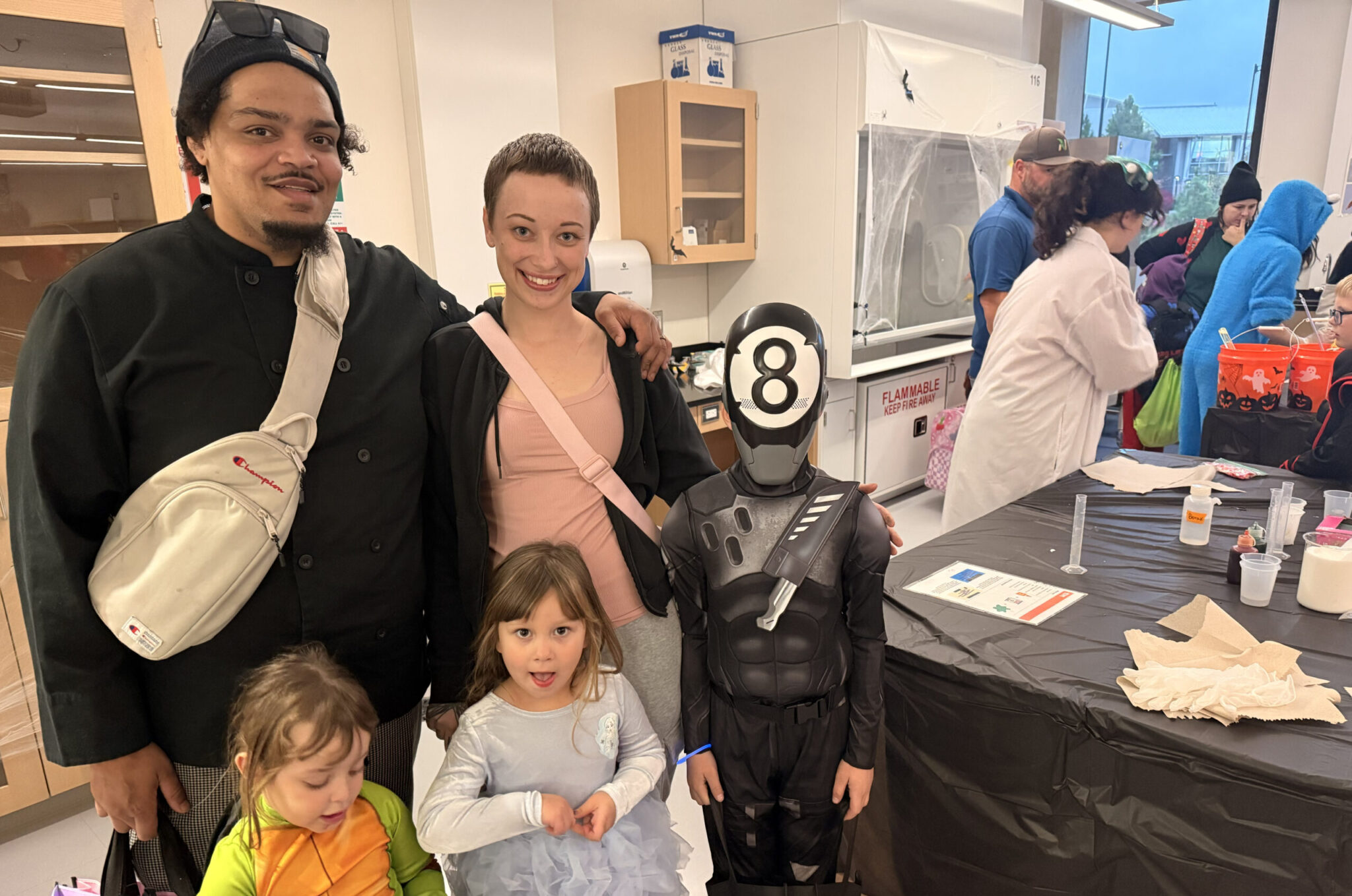 Parents with three children in costume.