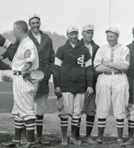 George Kelly is the taller gentleman on the left and standing behind the coach. Coveleski is the player standing in the second row between the two players in front of him.