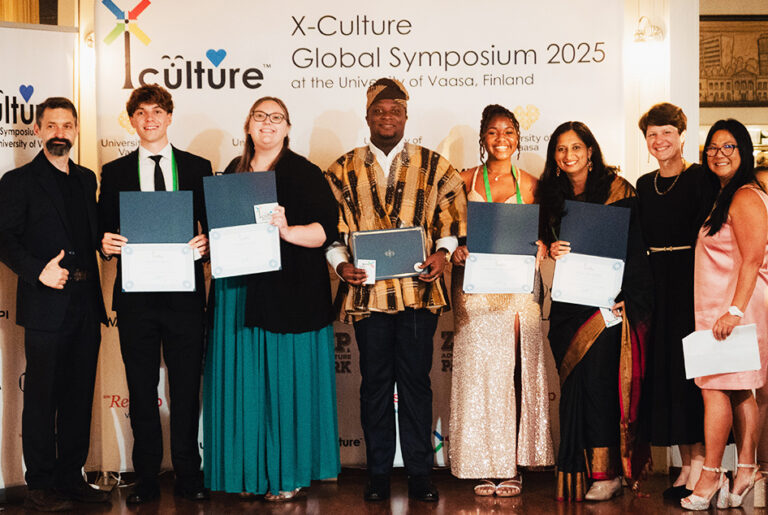 X-Culture team of eight with EWU student.