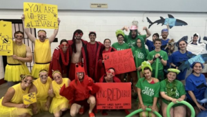 Photo of diving team captains in colorful outfits.