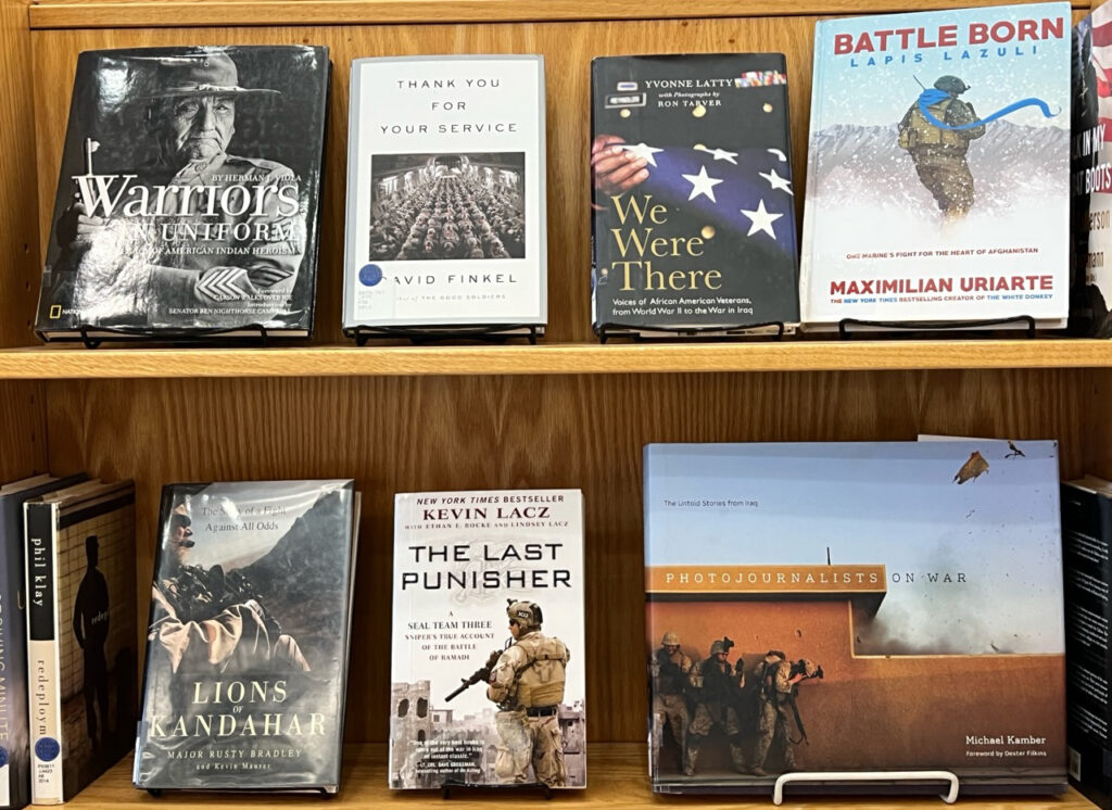Photo of books about veterans and conflicts.