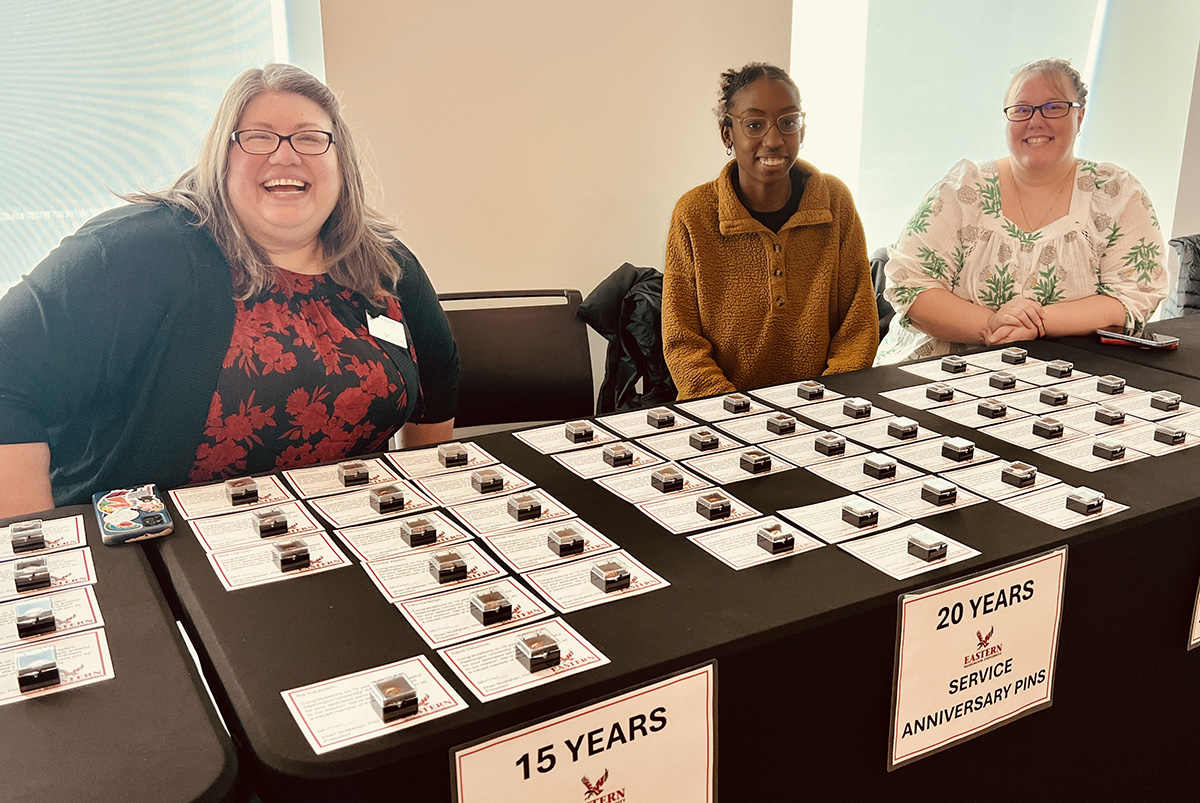 Tessa Delbridge, Stephanie Bradly, and Rama Bah handing out years of service awards.