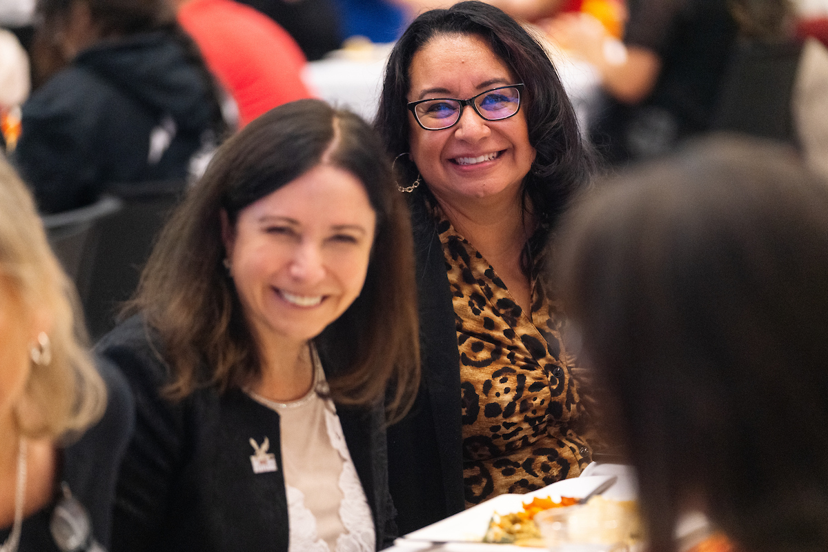 Two employees laughing.