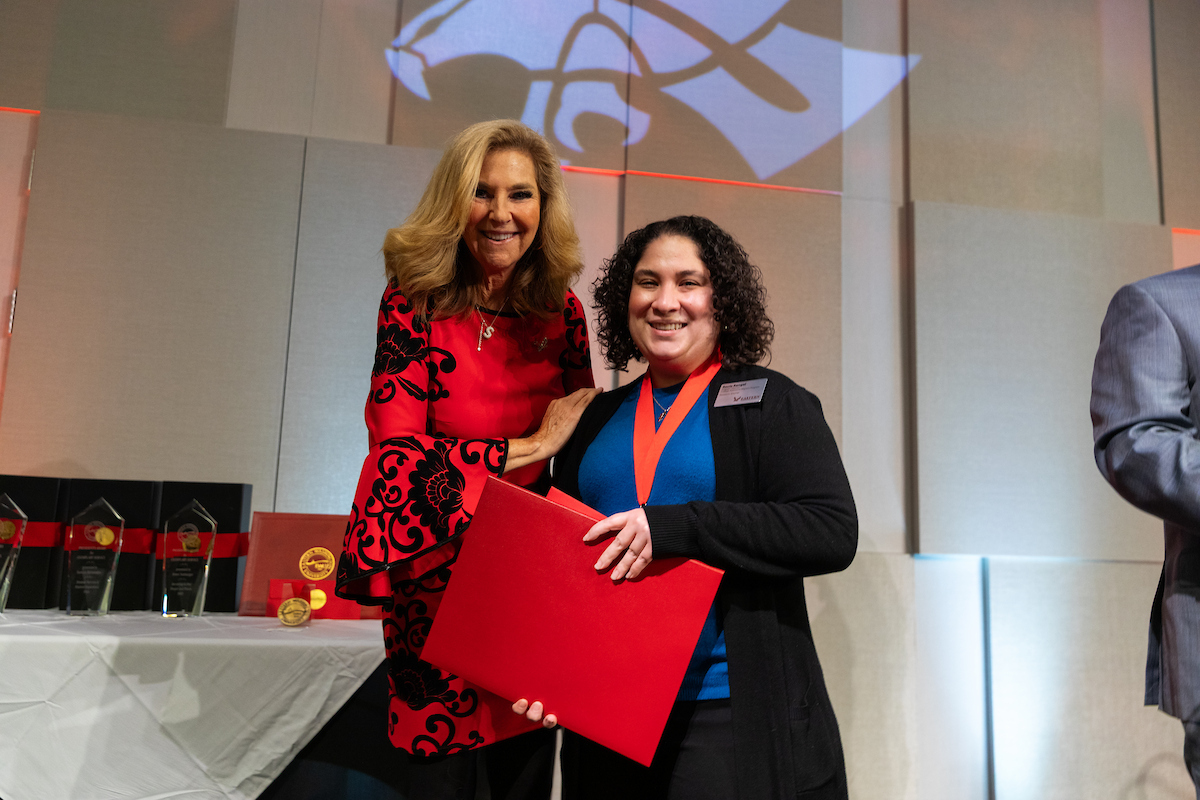 Rocio Rangel with President McMahan after receiving award