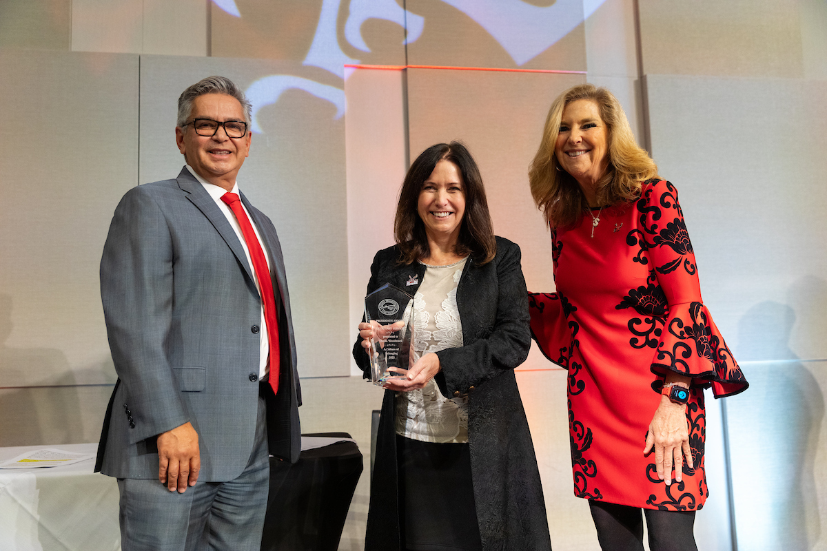 Award winner Sheila Woodward with Cesar Portillo and President McMahan