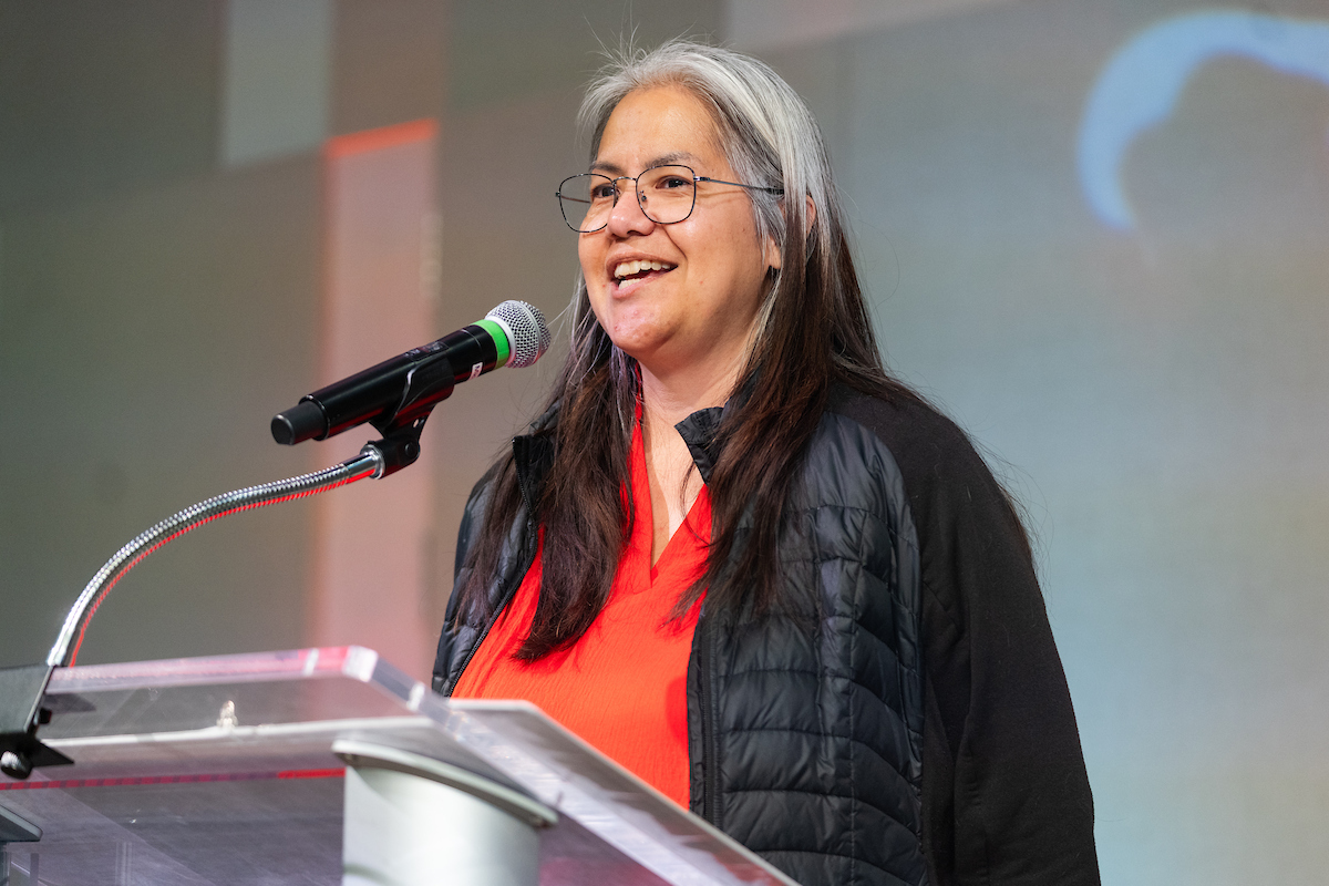 Christy Gilchrist giving the land acknowledgement presentation