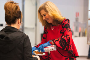 President McMahan serves pie to an employee.