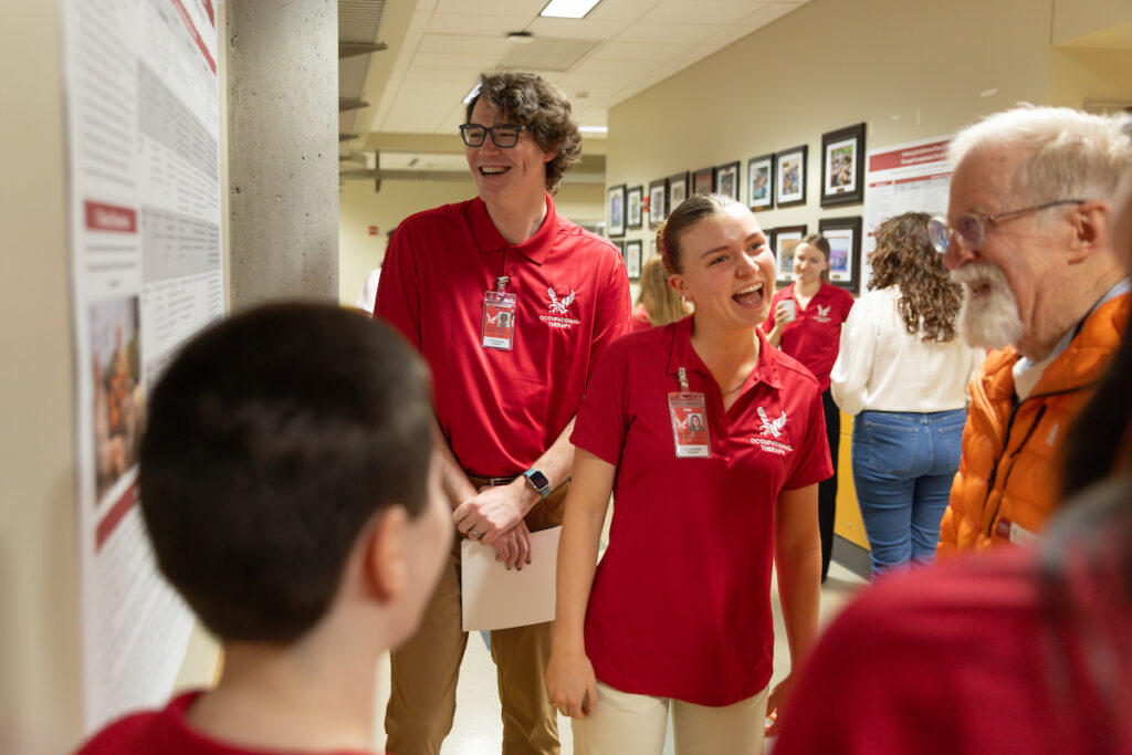 Youngs shares a laugh with OT students.