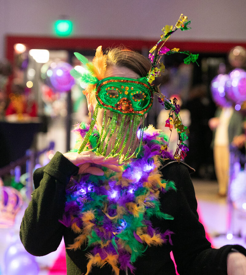 Employee fully decked out and posting on the pink runway.