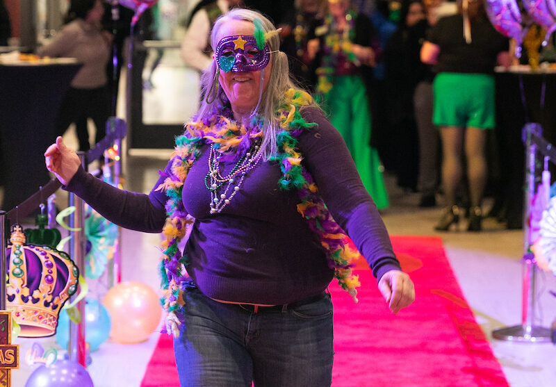 Employee decked out on the pink carpet.