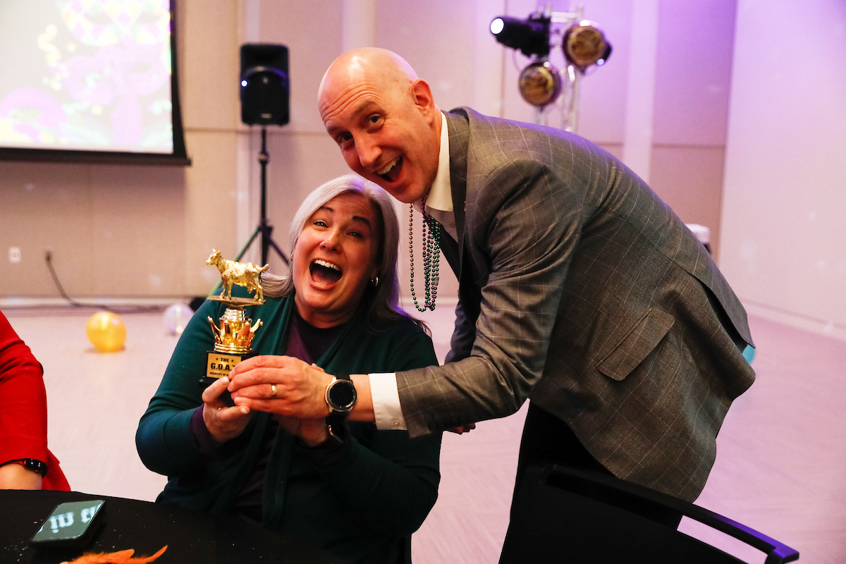 MarCom's Eric Limberg and Valerie Marsh pose with the trophy.