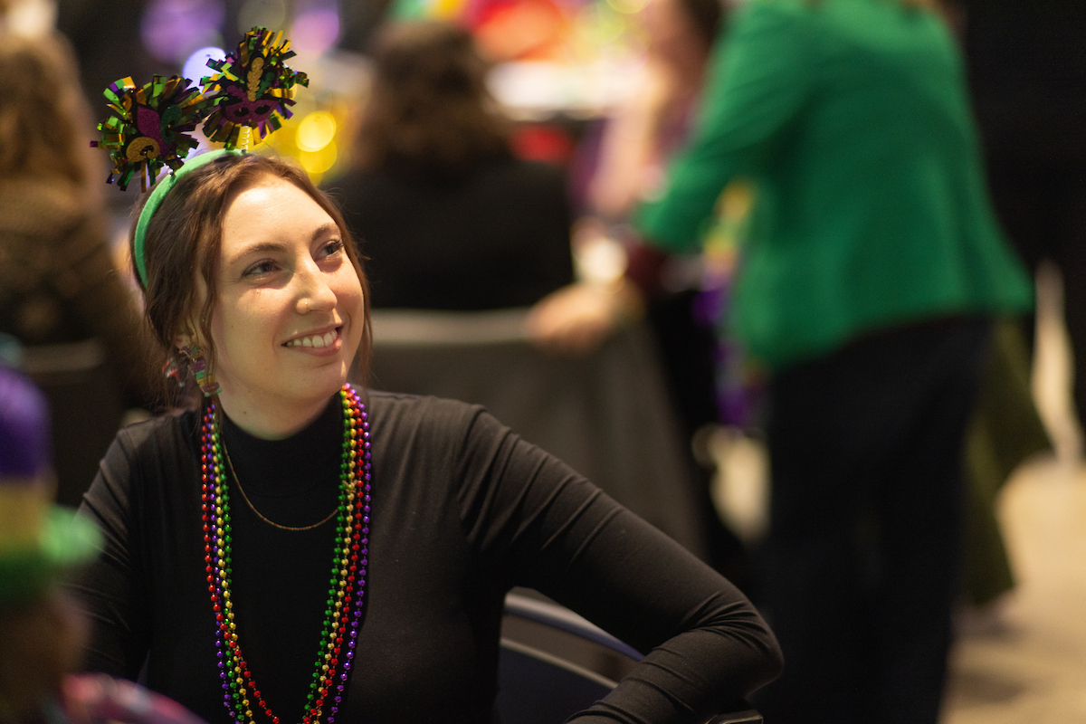 Employee decked out and smiling.