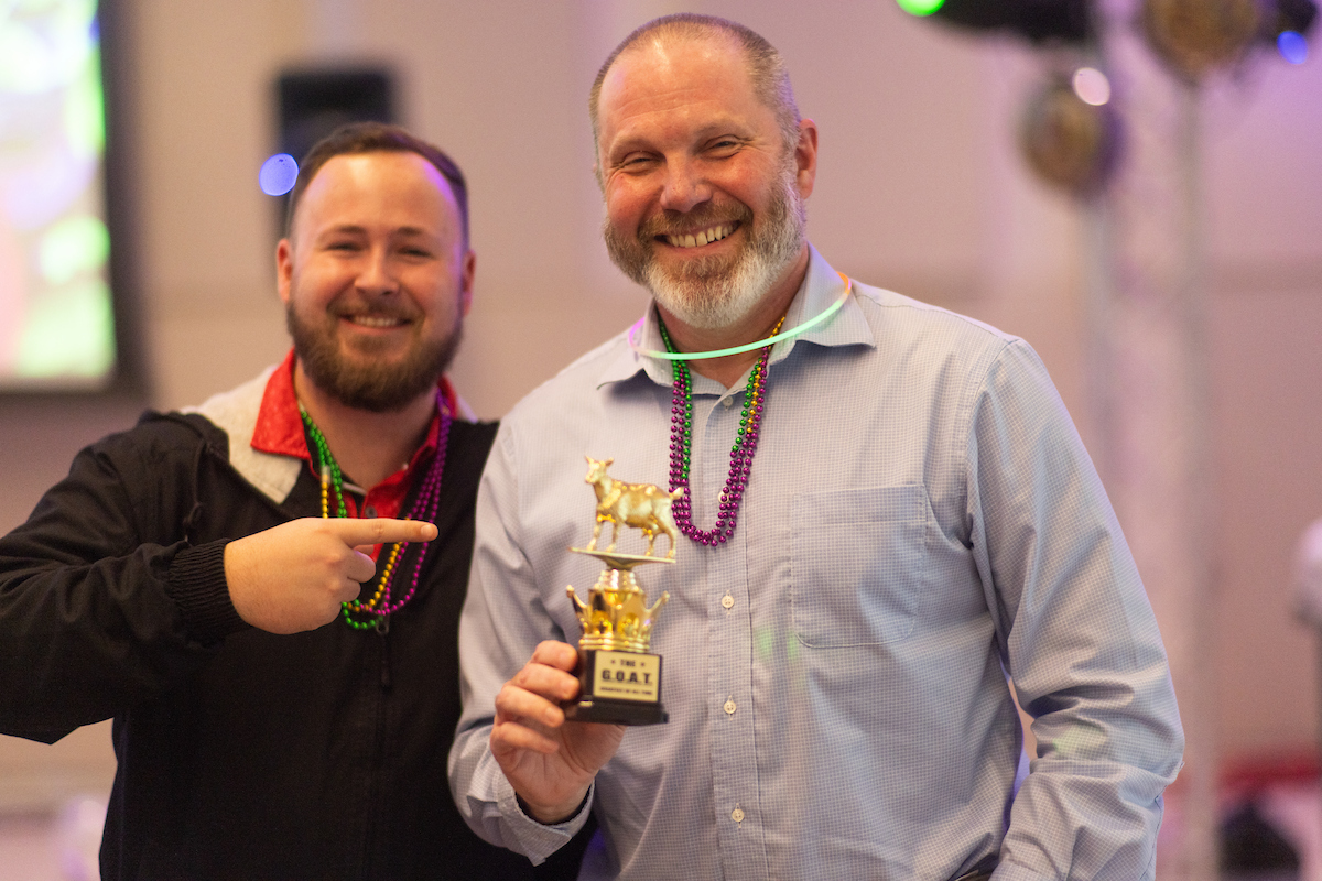 Linn Parish and Riley Baxter pose with the winning trophy.