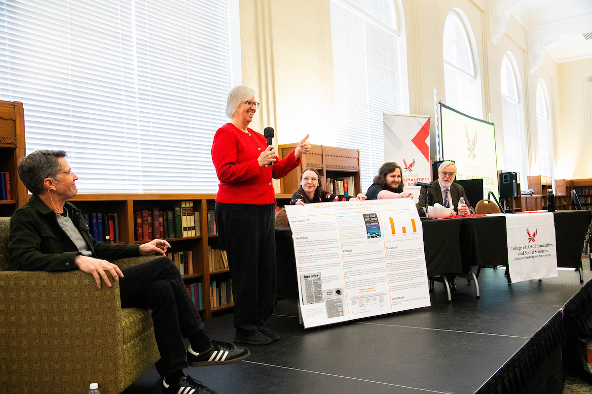 Students in the MFA program on a panel presenting to Jess Walter.