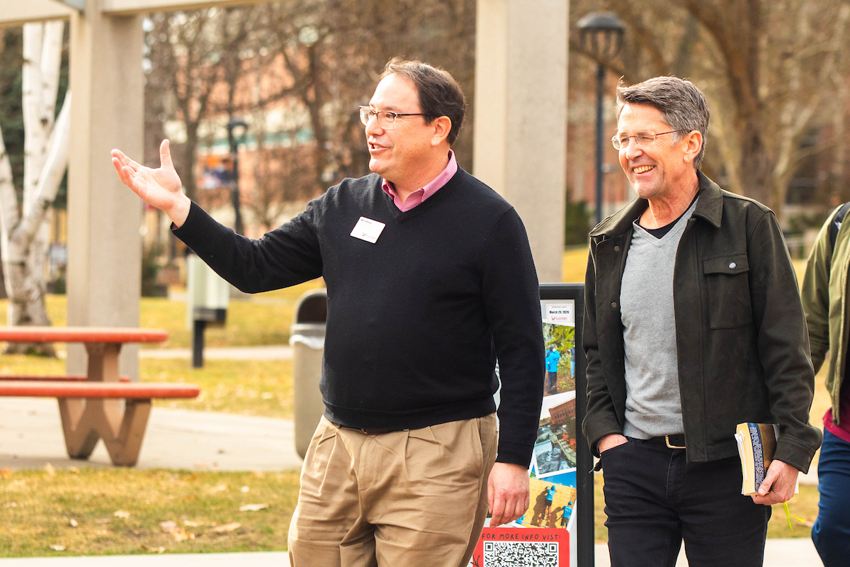Jess Walter with Will Simmons touring campus.