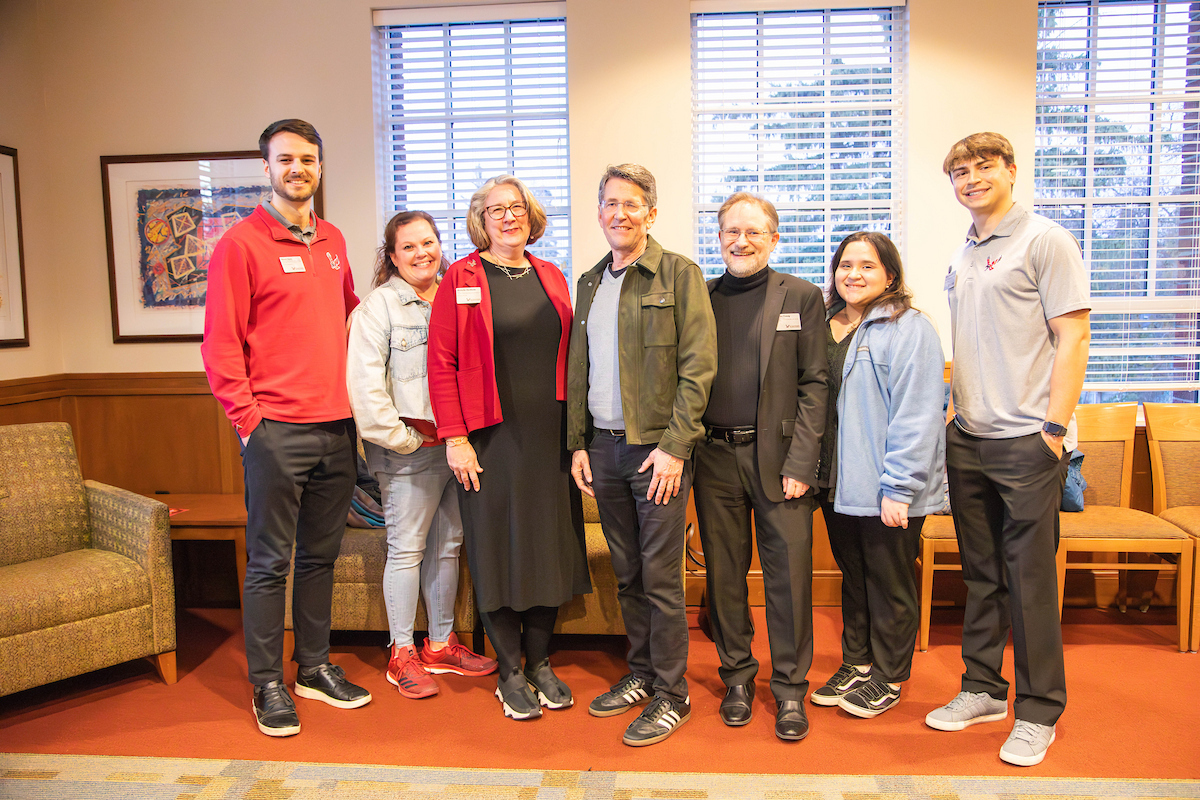 Jess Walter with six employees and students.