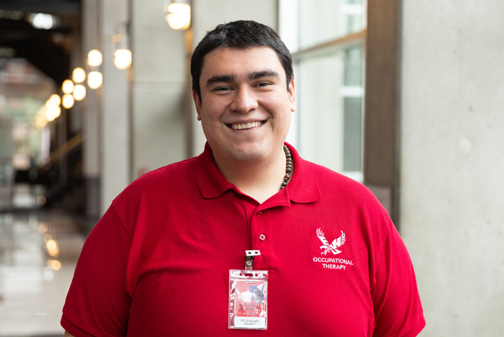 Photo of Eric Corona wearing his Eagle Red OT shirt.