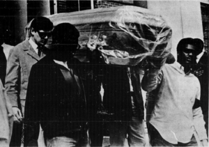 Black students carrying empty coffin after Martin Luther King Jr. was assassinated. 