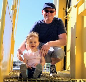 John was a doting father with their daughter, Zoë.