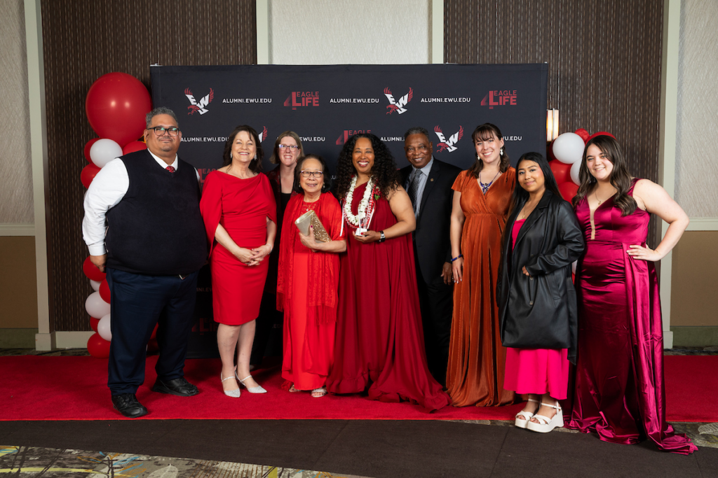 Award winning alumna, Angela Jones, with family members and EWU students.