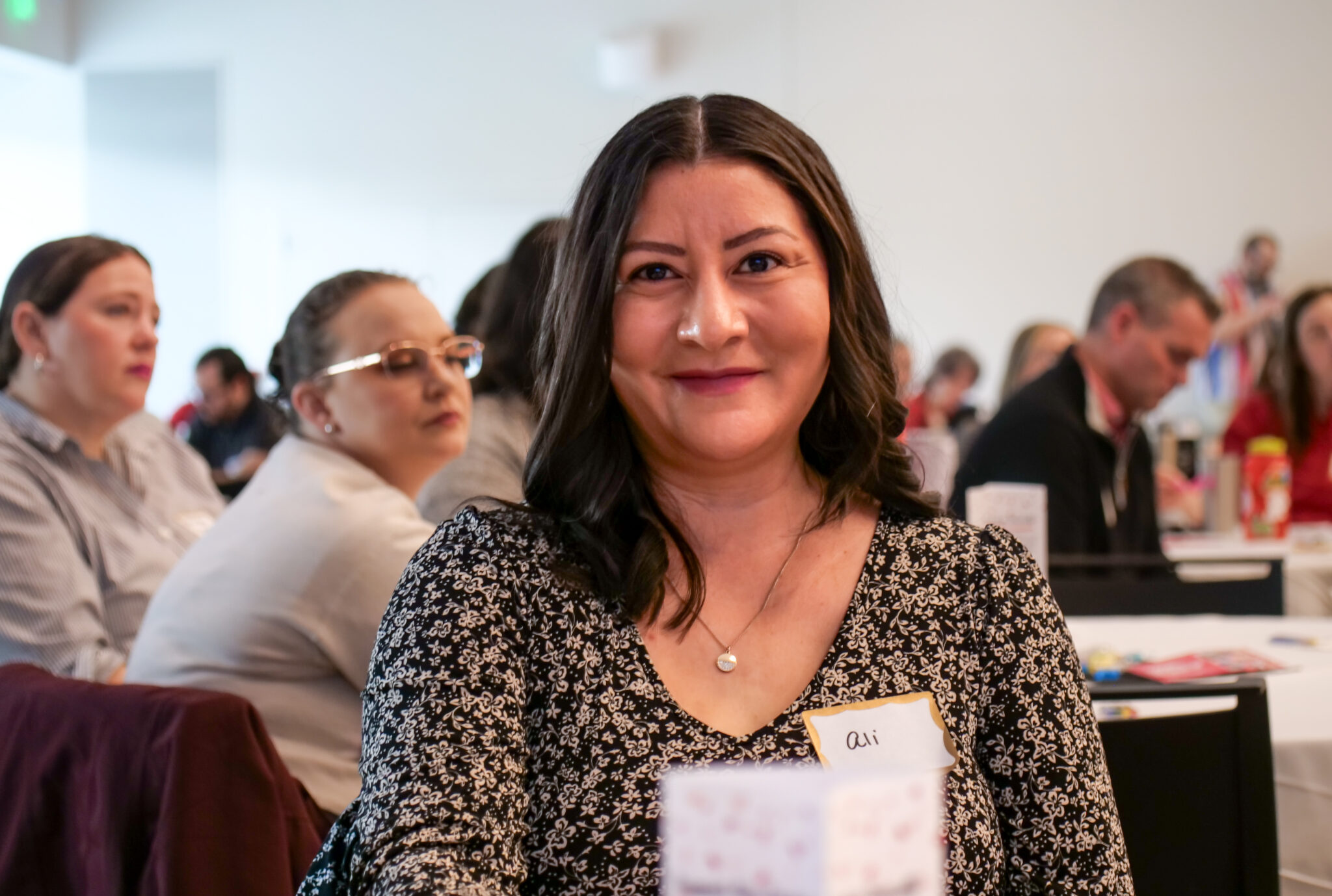 Portrait of an employee smiling.