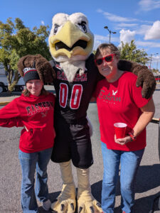 Zoë with Swoop and Tessa's mom wearing their Eagle geer.