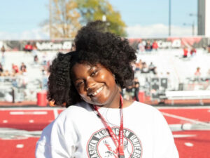 Picture of ZaKayla Jones on the red turf.