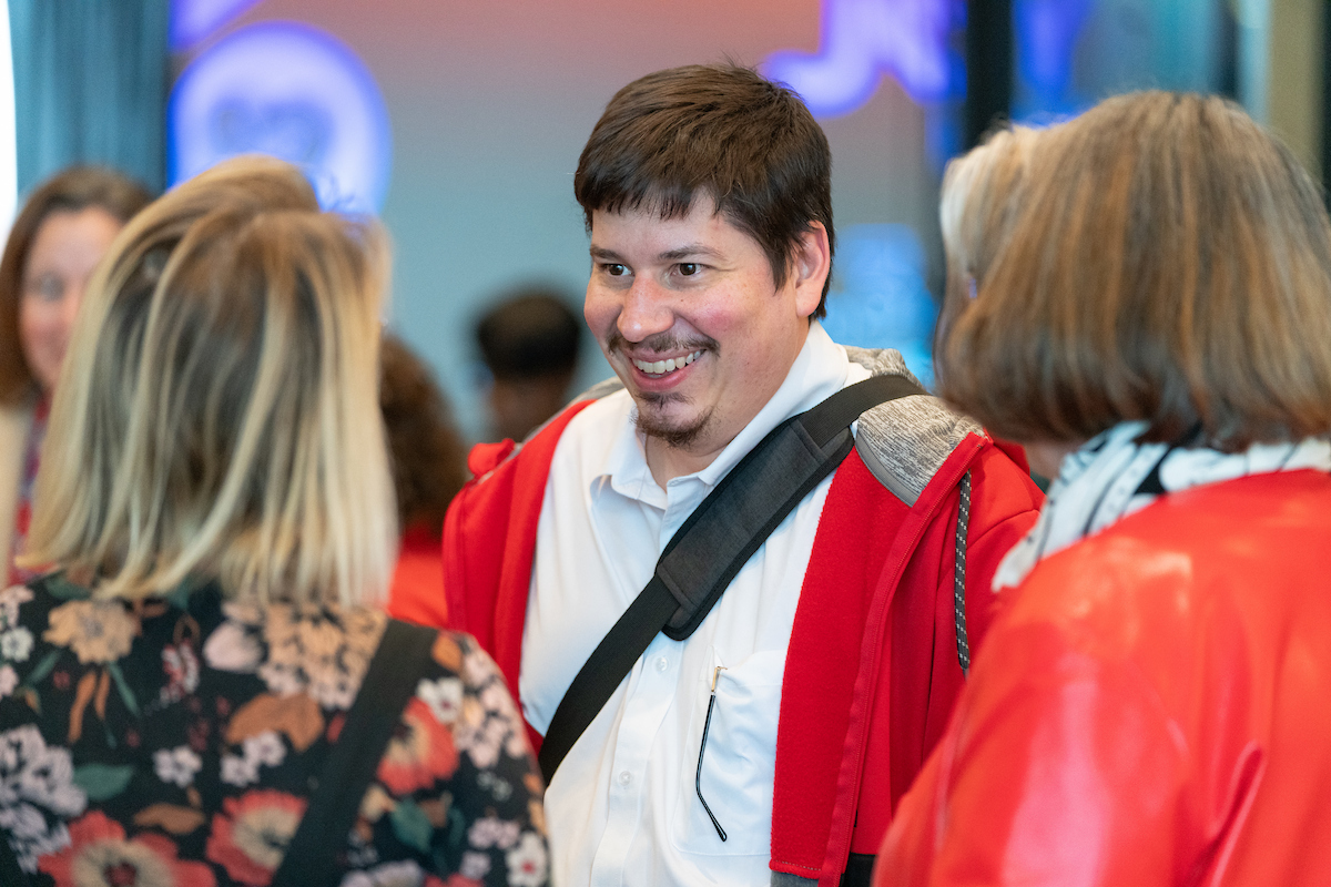 Carlos Castillo-Garsow smiling and talking.