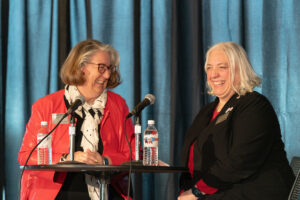 Michelle DenBeste and Jennifer Waldo share a laugh during the Password game.