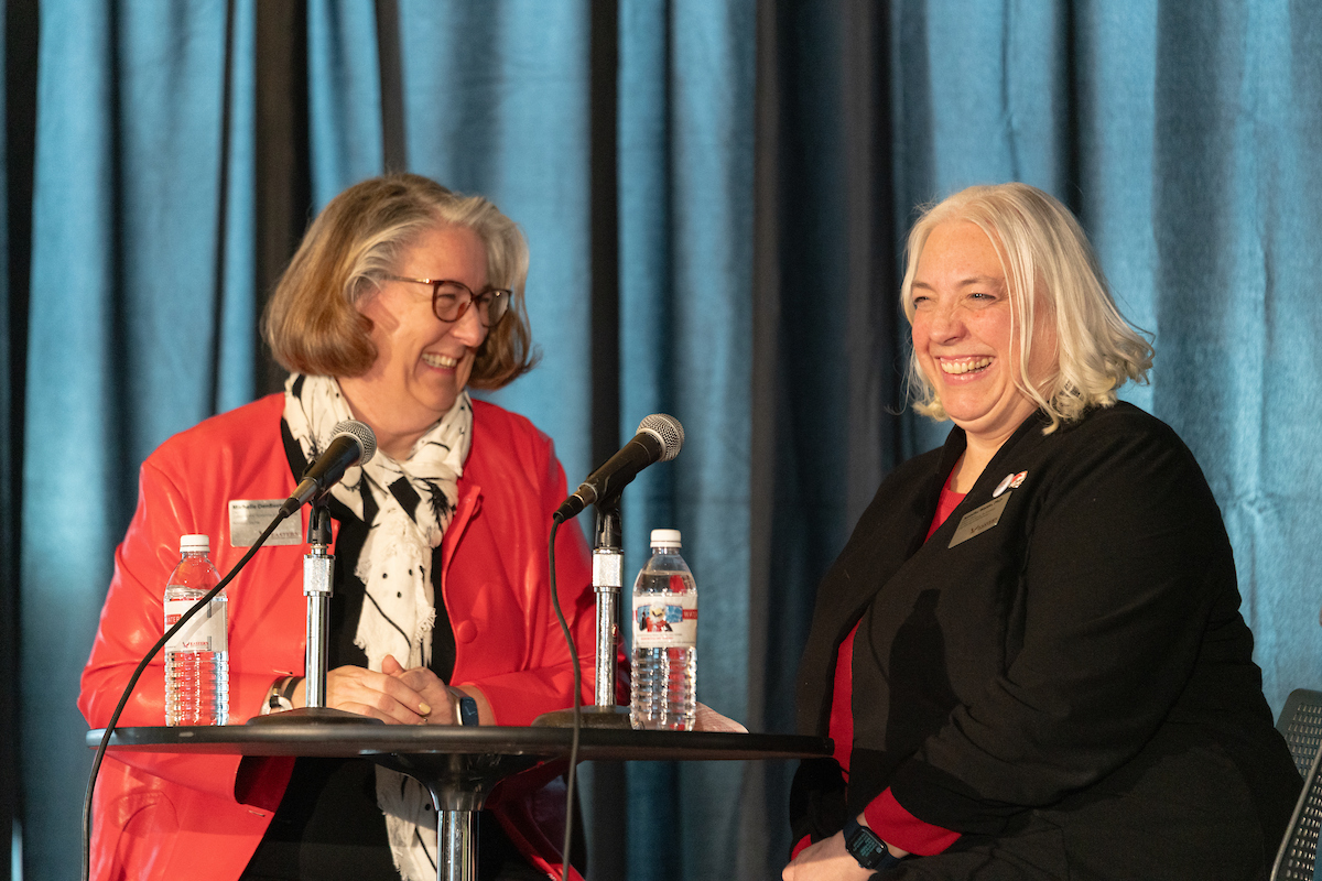 Michelle DenBest ane Jennifer Waldo laughing during Password.