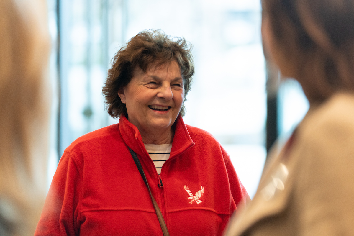 Person wearing an Eagle shirt and smiling.