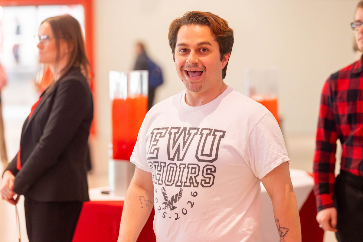 Student wearing an EWU shirt smiling.