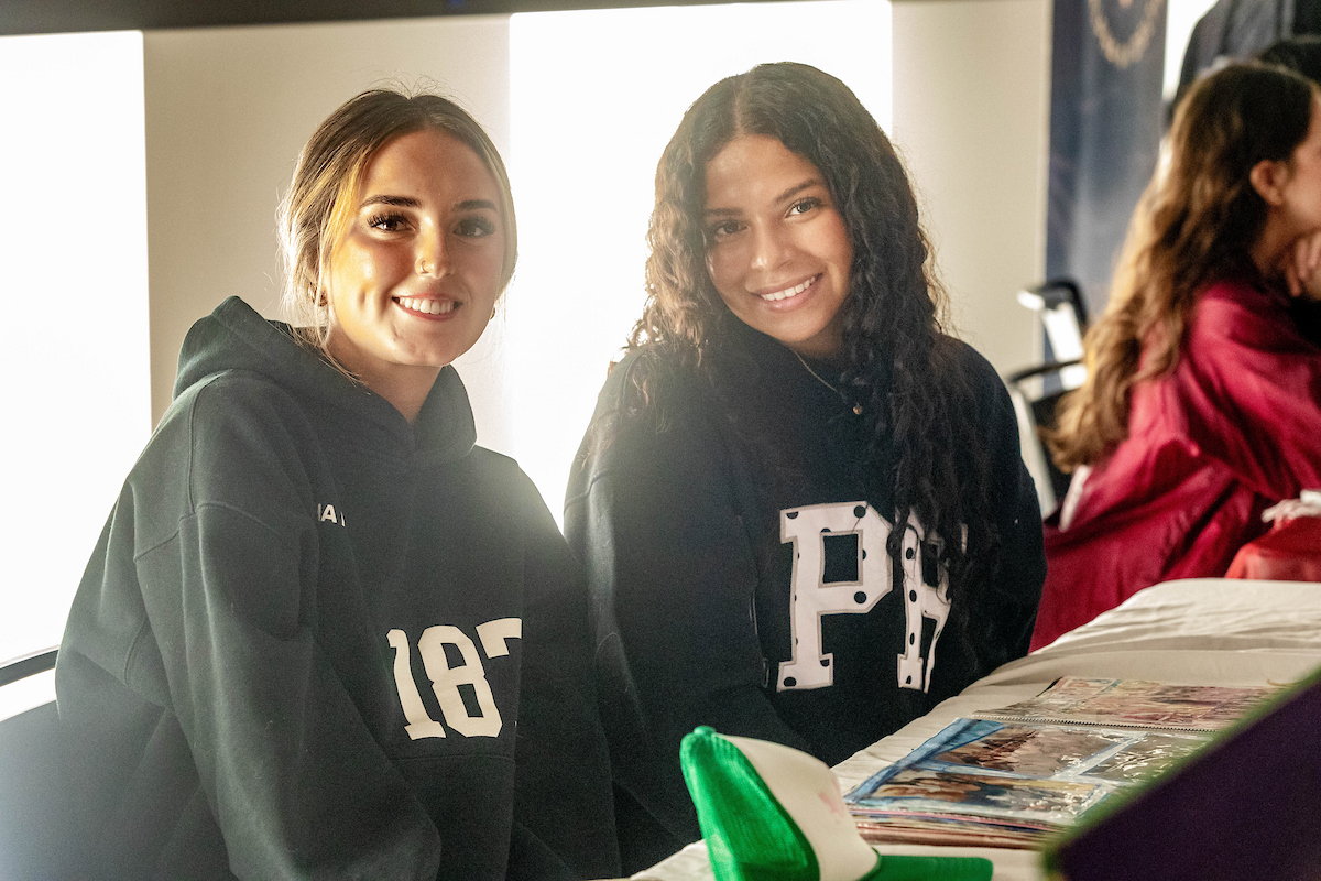 Two sorority members smiling.