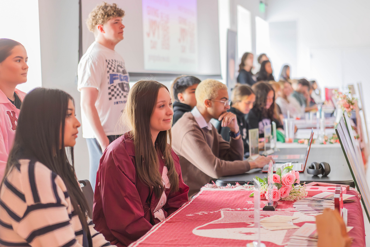 Sorority students manning a table at the PUB event in the NCR.