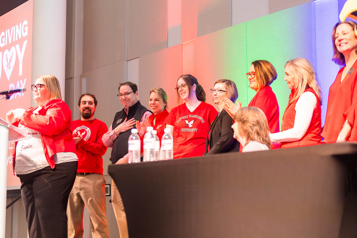 Philanthropy team on stage being recognized.