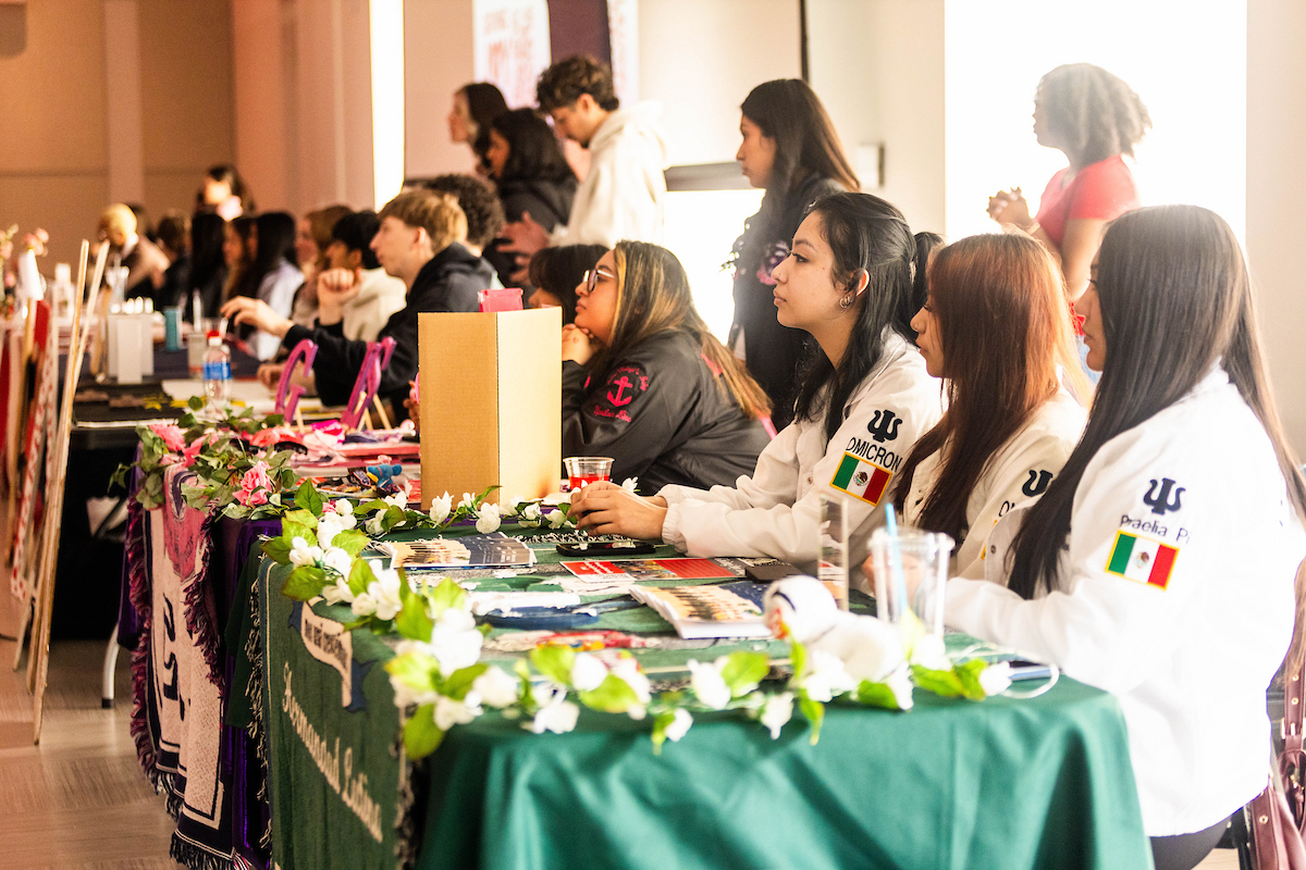 Students who belong to a sorority manning a table at the PUB event in the NCR.
