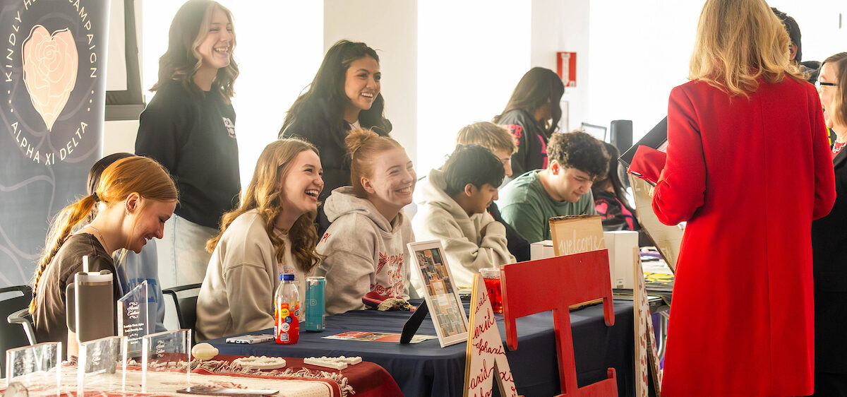 President McMahan talking to sorority members.