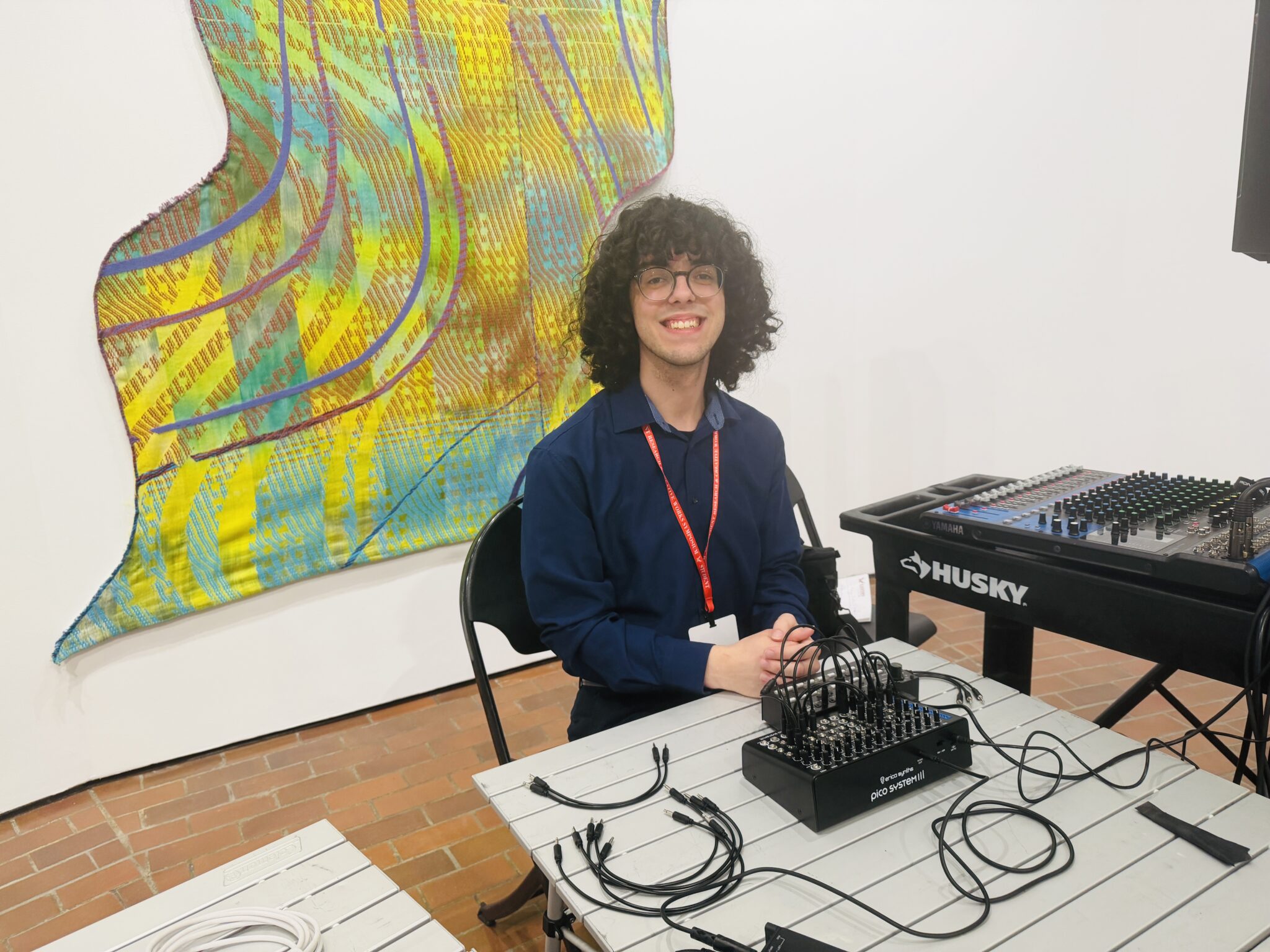 Student sitting with synthacizer he played.