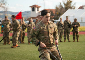 EWU cadet competing with other cadets in the background.