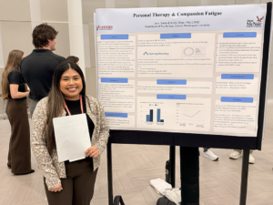 Student with her poster presentation.