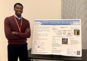 Student with his poster board presentation.