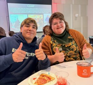 Alexander Urbina with his manager, Emily Migliazzo, doing thumbs up.