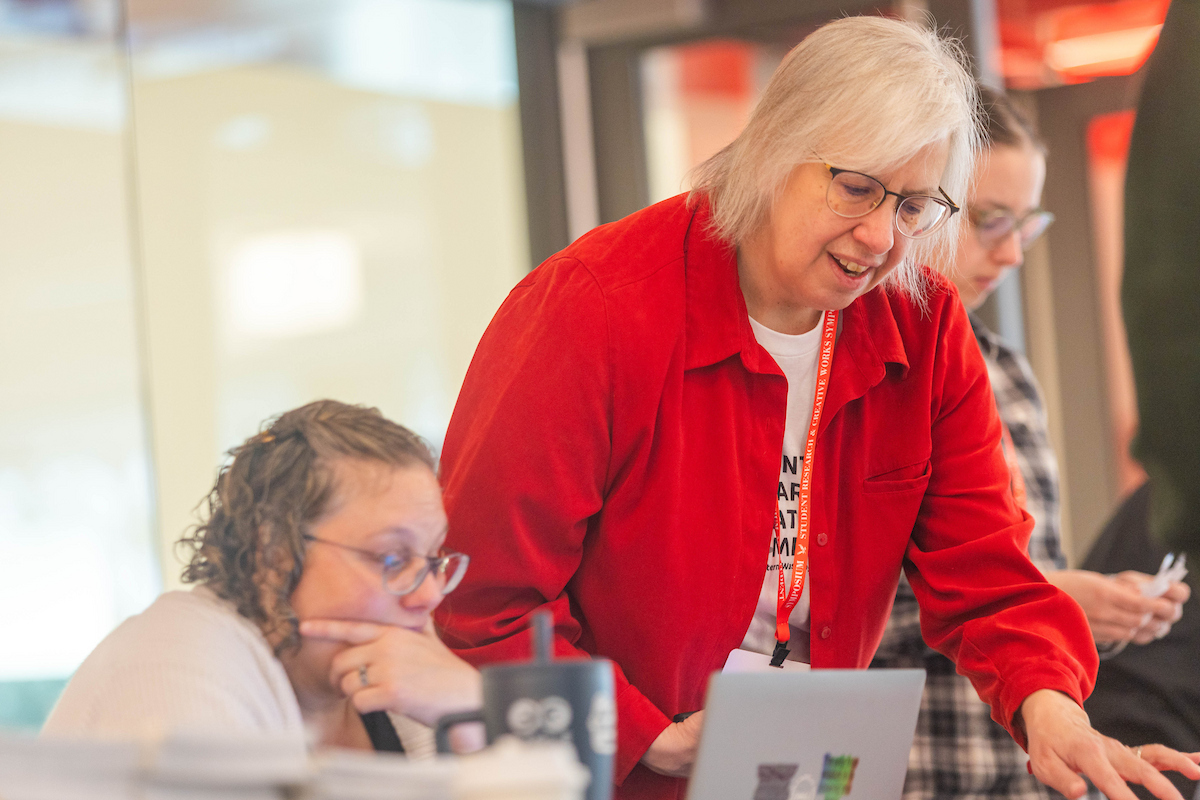 Faculty and staff doing check-in