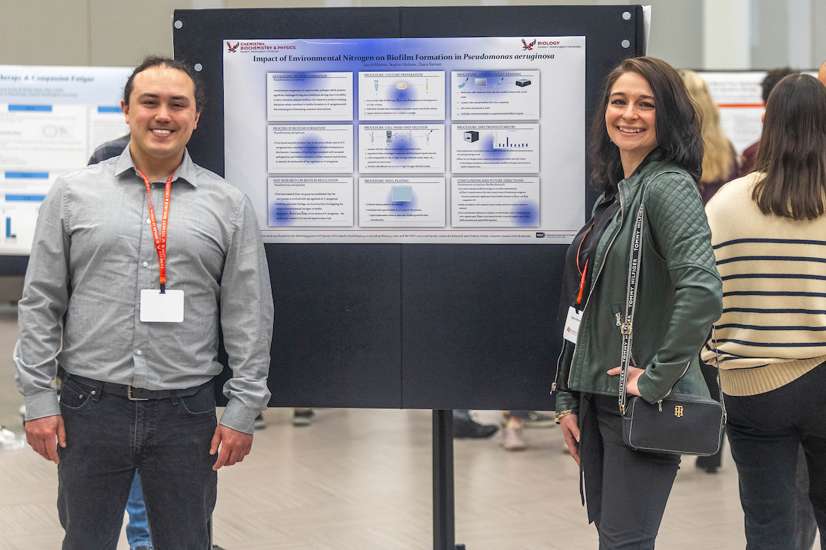 Two students with poster presentation