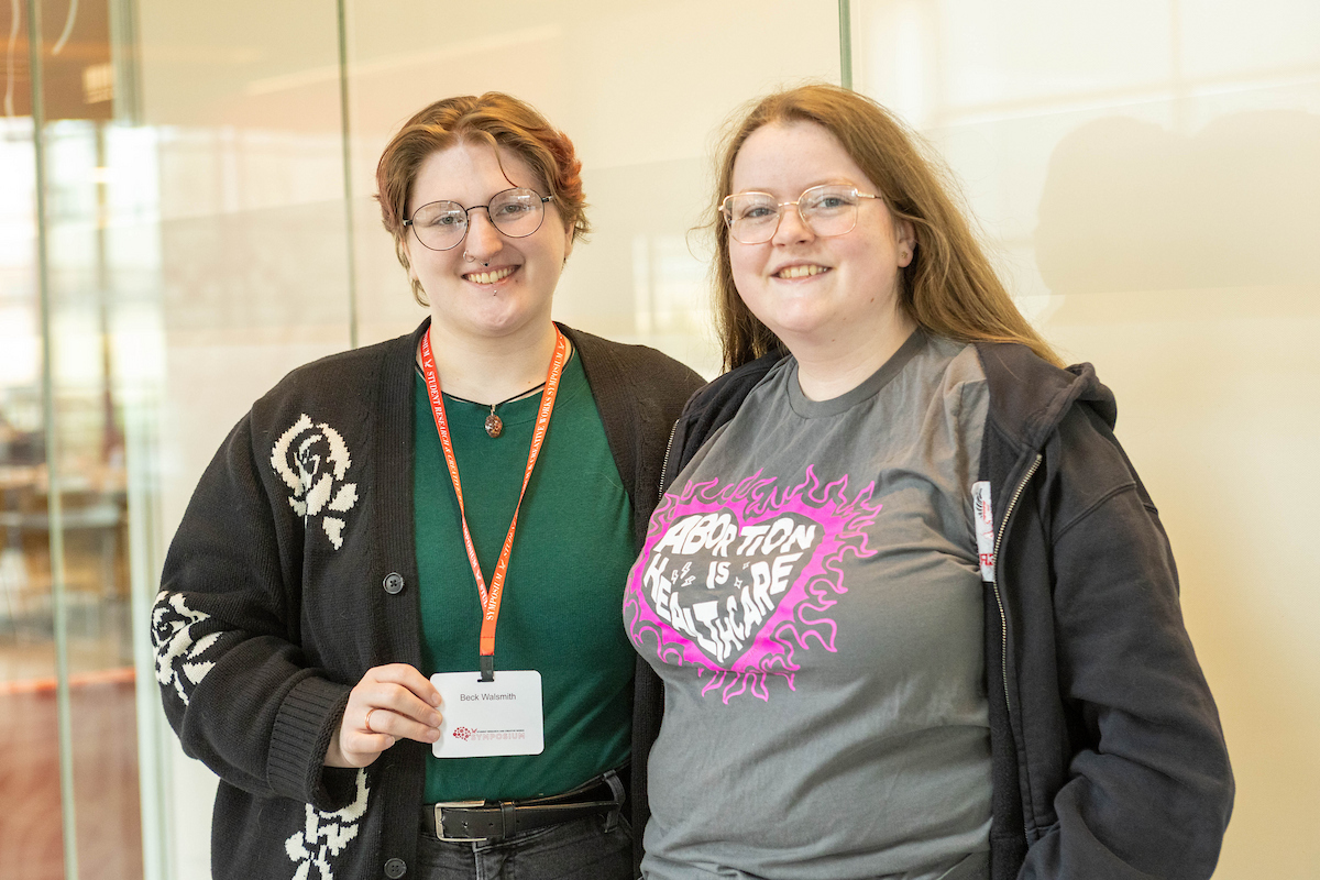 Two students smiling