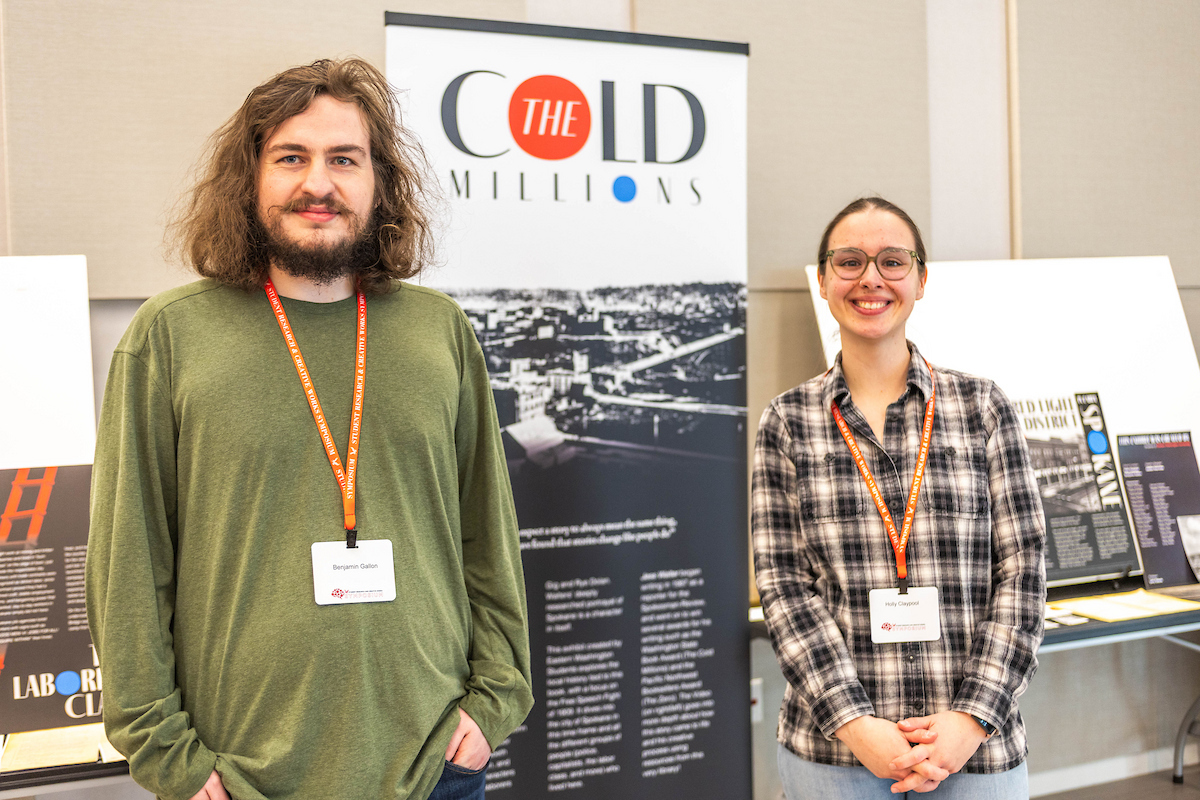 Two students with their poster presentation.
