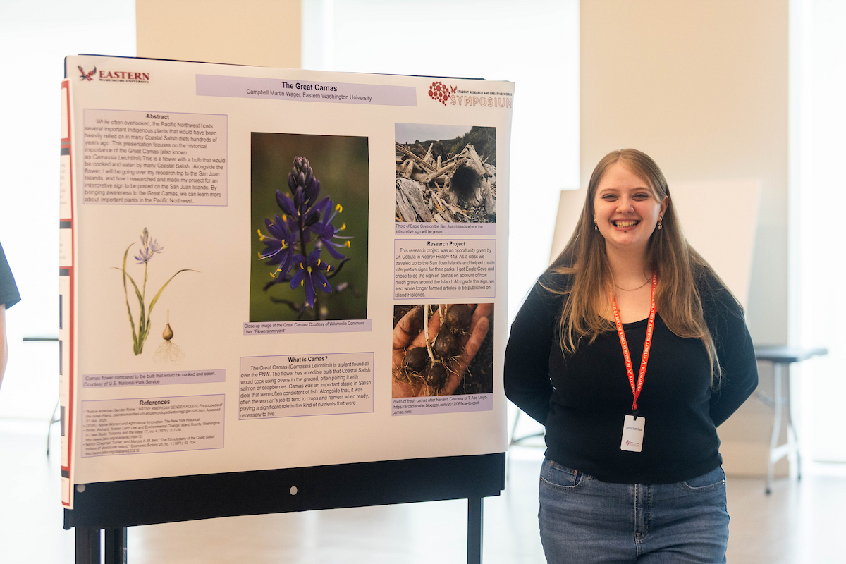 Student with a poster presentation