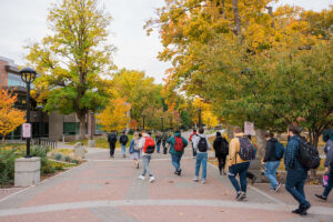 Photo of students walking to the PUB in the fall.